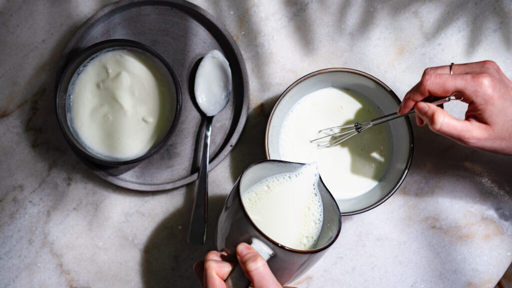Milk and yogurt are poured together to make your own yogurt.