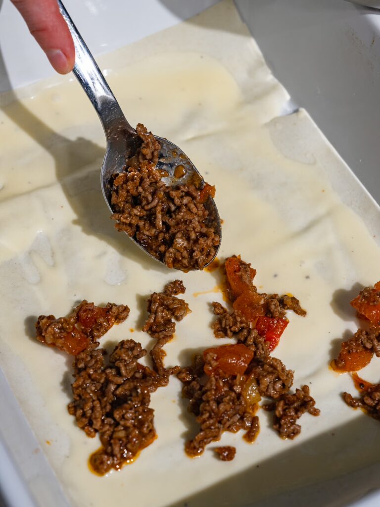Minced meat sauce is also spread on yufka dough in a form for börek with minced meat.