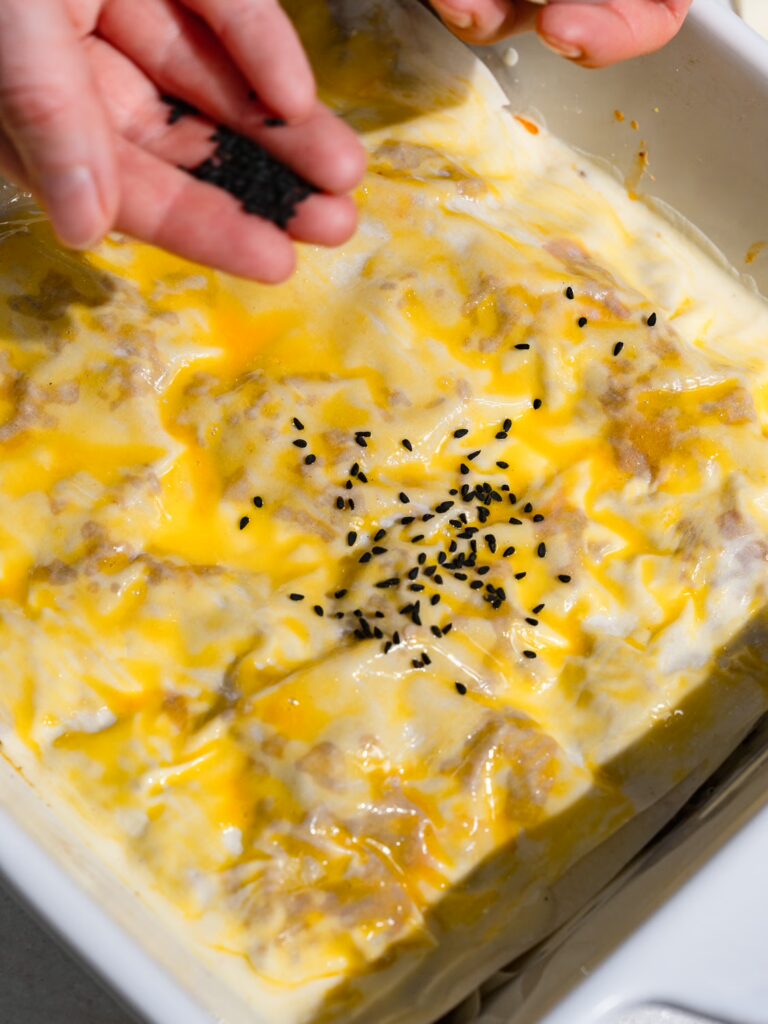 Börek with minced meat is sprinkled with cumin seeds.