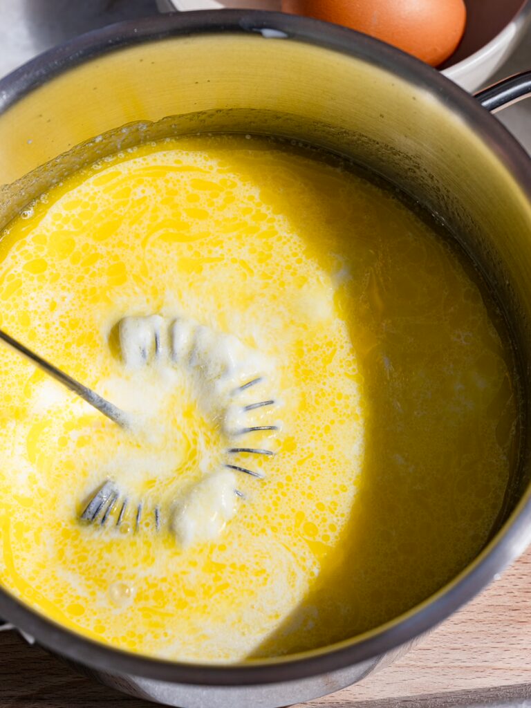 Mix melted butter with milk and yogurt.
