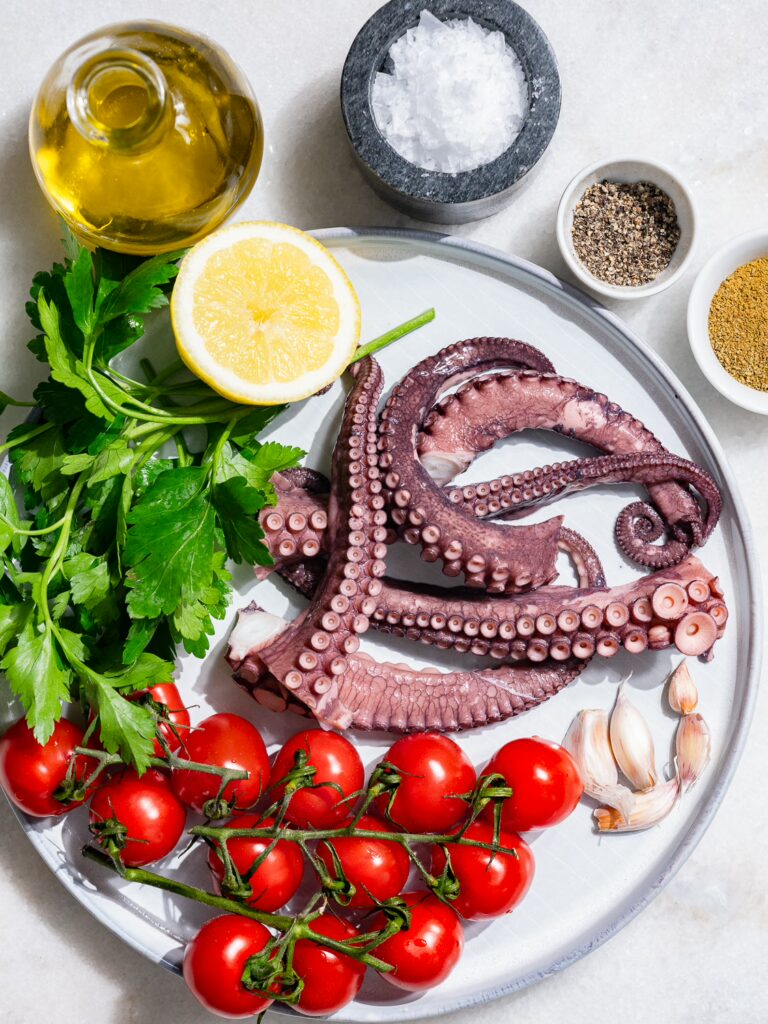 All the ingredients for Mediterranean pulpo salad on one table.